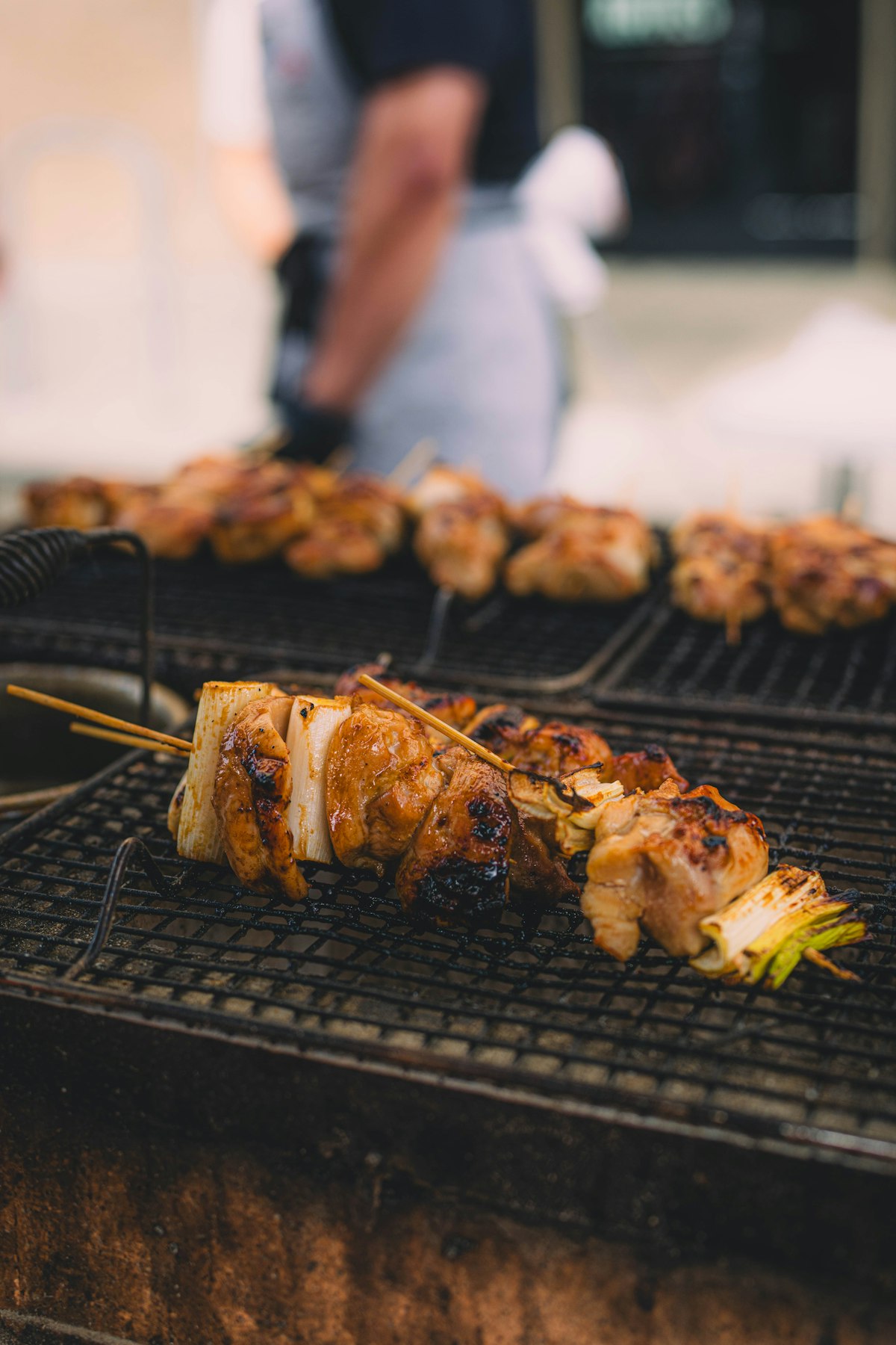 Chicken and leek skewers on a grill